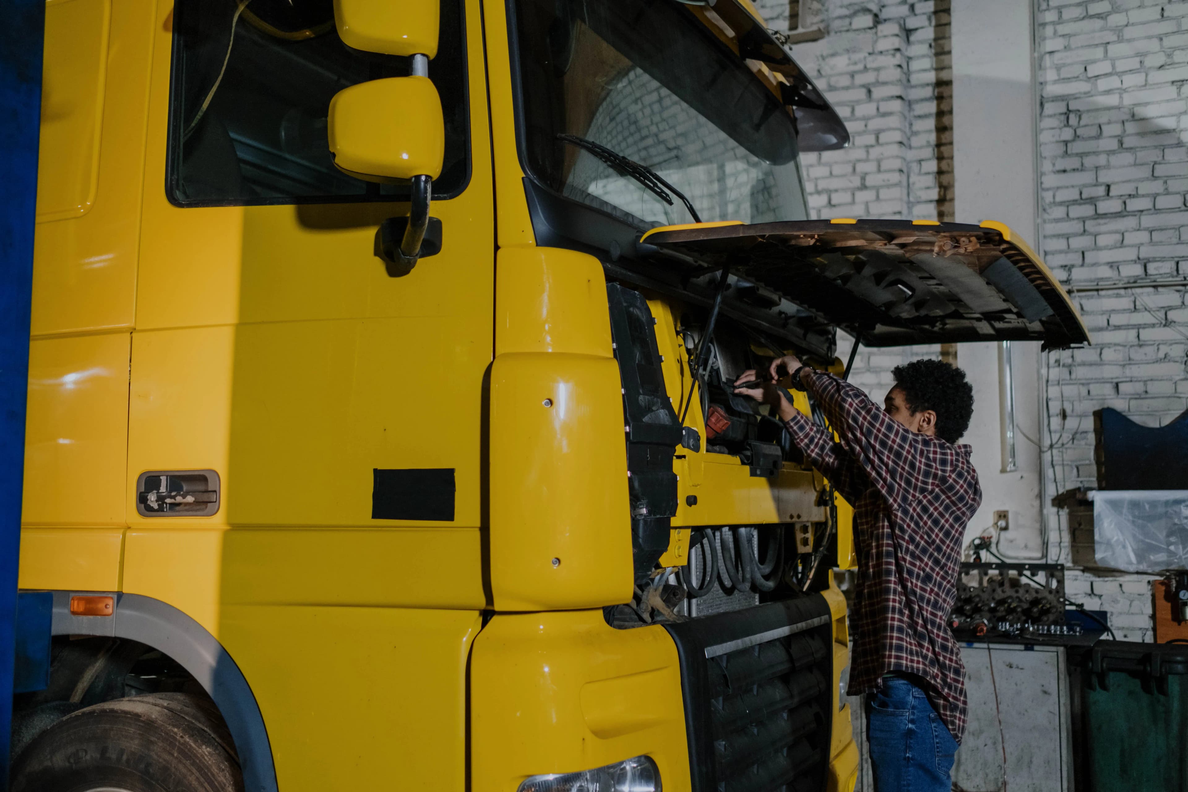 Mechanic working on a truck engine
